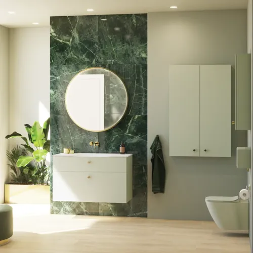 Tyylikäs ja ylellinen kylpyhuone, jossa on pehmeitä vihreitä sävyjä, suuri elegantti pyöreä peili ja moderni, hienostunut vihreä wc-istuin