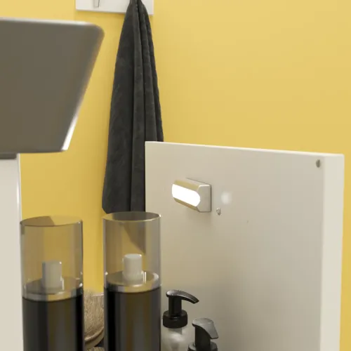 Pienen kylpyhuoneen inspiraatio valkoisella pesuallaskaapilla mustalla vetimellä ja mustalla tyylikkäällä altaalla, kaunis pyöreä peili mustalla reunalla, terrazzoseinä ja -lattia ja keltaiset seinät antavat rohkean ja modernin ilmeen.